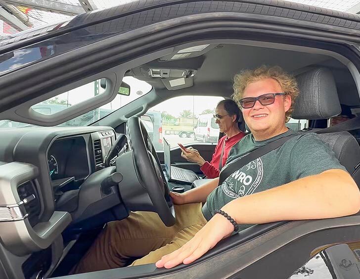 HUNTING HAIL STORMS -- Christian Anderson pilots one of the storm chaser vehicles that stopped in Eldorado on Monday. He and his associates, Ed Mansell and Dominic Bentley, were hoping to intercept a hail storm as they left Eldorado headed north. -- KATHY MANKIN | THE ELDORADO SUCCESS