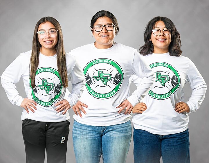 POWERLIFTING ROYALTY! The Lady Eagle powerlifting team claimed their second consecutive State Championship on Wednesday, March 13th in Frisco.  (L-R) seniors Alejandra Alegria and Nyomi Aranda each claimed a gold medal while freshman Mari Cruz Esparza won a silver in the State Meet held at Comerica Center.| ILLUSION’S PHOTOGRAPHY