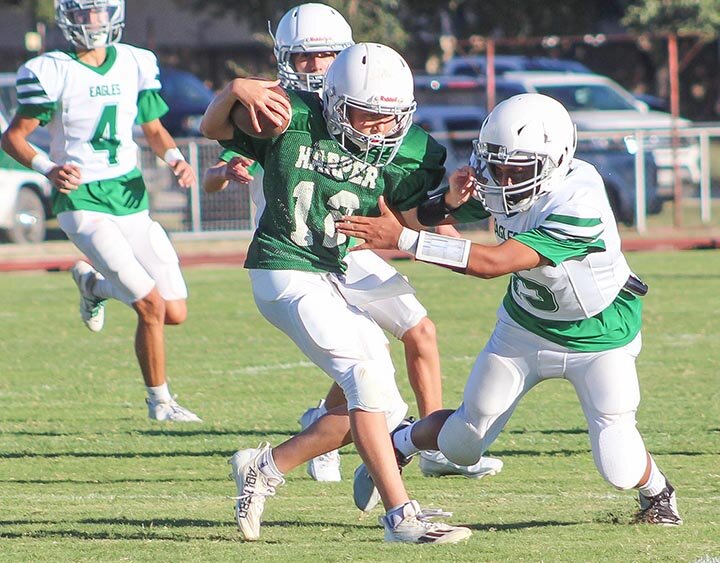 EMS GRIDIRON ACTION -- Eldorado Middle School Eagles linebacker Markos Moya tracked down Harper’s quarterback and took him to the ground on Thursday, September 26th in Harper. Moya also scored all three of Eldorado’s touchdowns as the young Warbirds claimed the 18-6 victory. --  MANDI UMPHRESS | THE ELDORADO SUCCESS