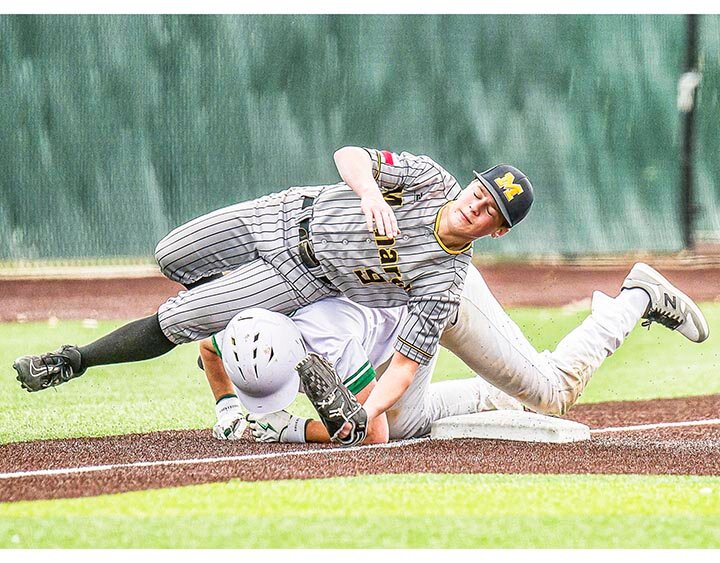 BASEBALL IS INDEED A CONTACT SPORT -- Cody Bybee slides in safe under the tag as he steals third on Thursday, February 27th, as the Eldorado Eagles faced the Menard Yellowjackets in Reagan County’s Edward “Lalo” Soto Baseball Classic in Big Lake. Bybee came home on an error by the Menard third baseman, helping spark the Eagles rally. Eldorado went on to win the game 15-10 -- .J.L. MANKIN | THE ELDORADO SUCCESS