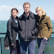 Eric Dane is flanked by Natalie Zea and Carolyn Stotesbury in between scenes on board the M/V Eagle