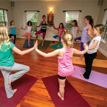 Caitlin Marcoux leads a class in Strong Girls Yoga, focused on giving them self-esteem as well as exercise.
