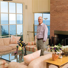 Architect Graham Gund in the living room of his home on the north shore, with views of Nantucket Sound through the windows.