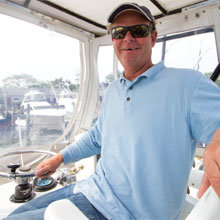 Captain Marc Genthner at the wheel in the Nantucket Boat Basin