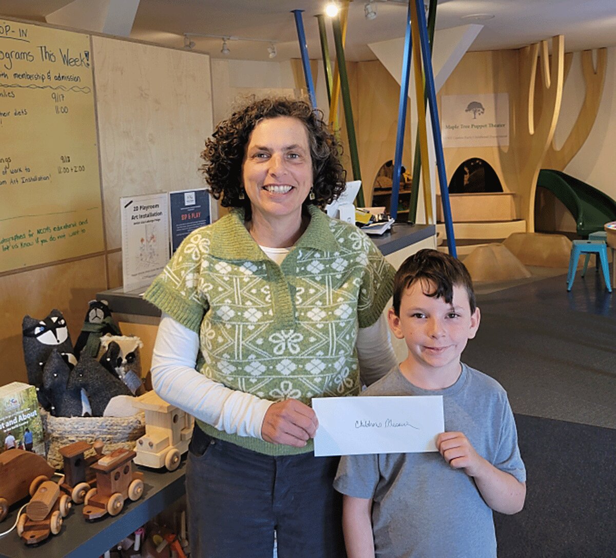 Kiwanis member Zane Jimenez, 6, presented a recent donation from the Potsdam Kiwanis to Children's Museum Executive Director Sharon Vegh Williams.&nbsp; Photo submitted.