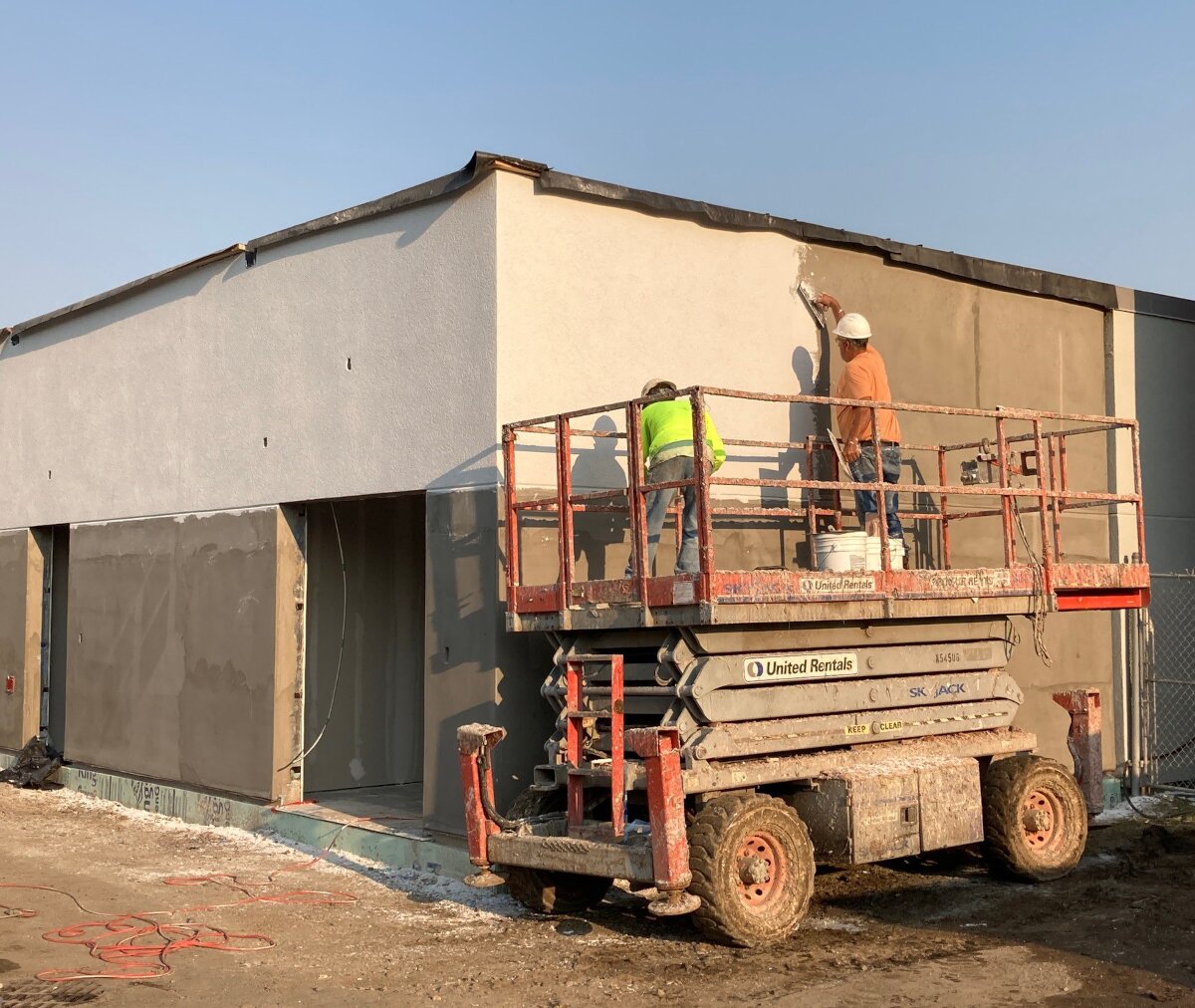 A construction team applies stucco to the new temporary entrance under construction on the Cottage Street side of Canton-Potsdam Hospital. Photo submitted by Pam Klosowski.