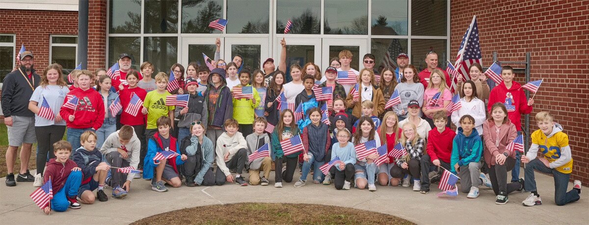 Gouverneur Middle School students celebrate P2 Character Strengths in an Old Glory Relay Race as part of Veterans Day festivities. Photo submitted by Michael Hammond, assistant principal.