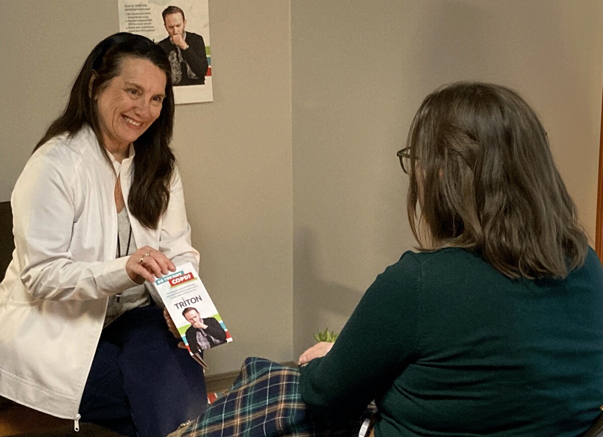 St. Lawrence Health Clinical Research Nurse Coordinator Jennie Flanagan, RN, discusses a clinical trial drug with a COPD patient and clinical trial participant. Submitted Photo.