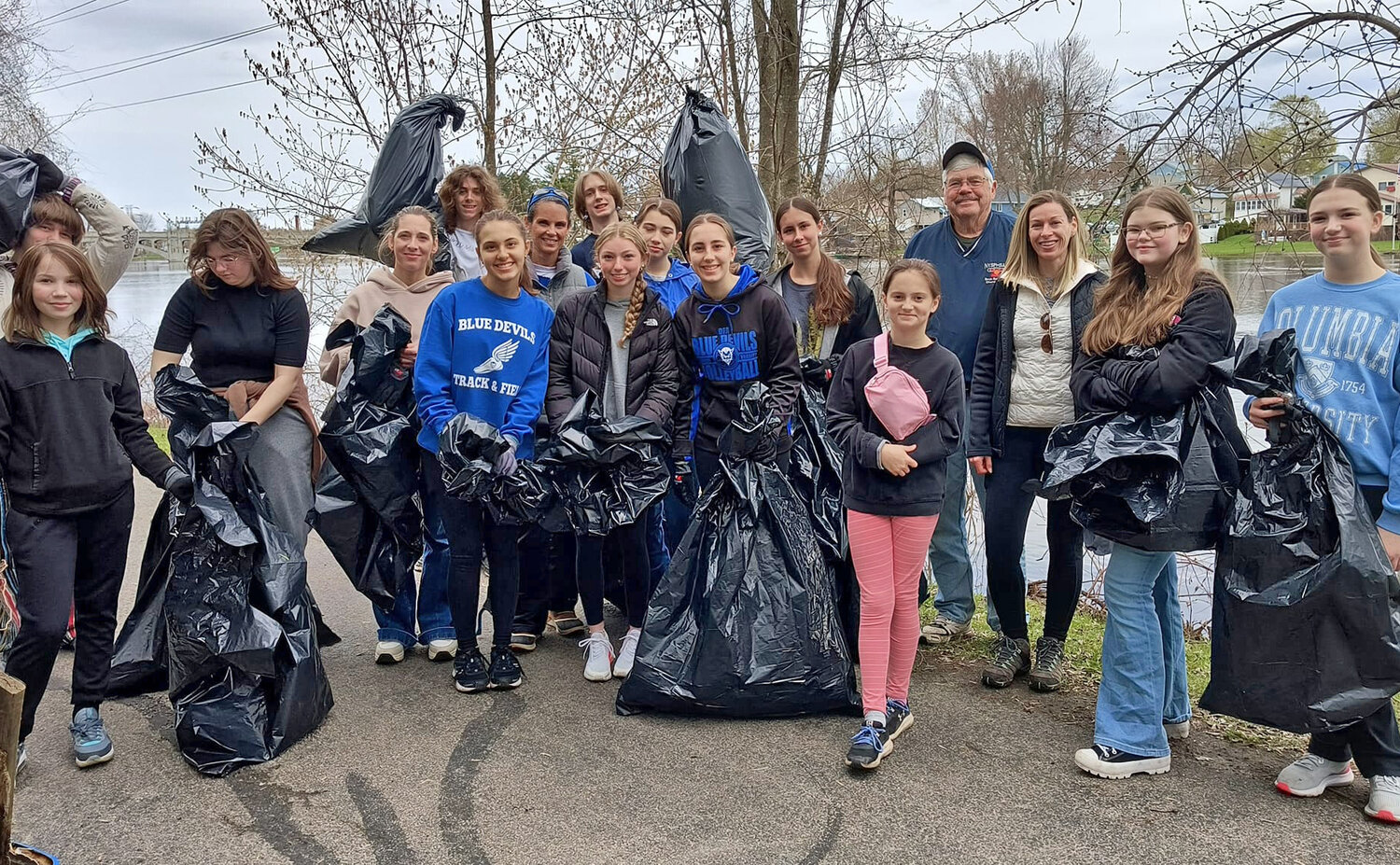 Volunteers help with Earth Day cleanup at Maple City Trail in ...