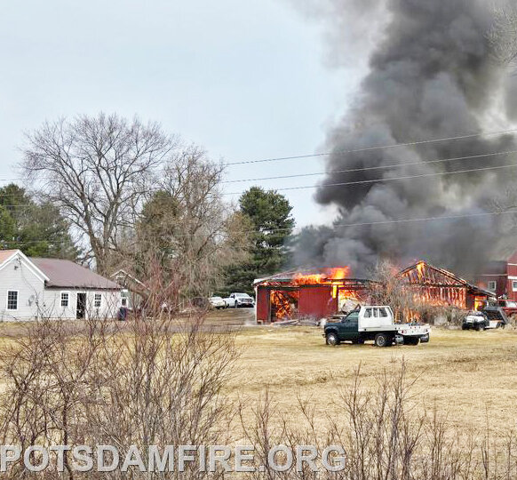 Multiple fire departments respond to garage fire on State Highway 345 in Potsdam