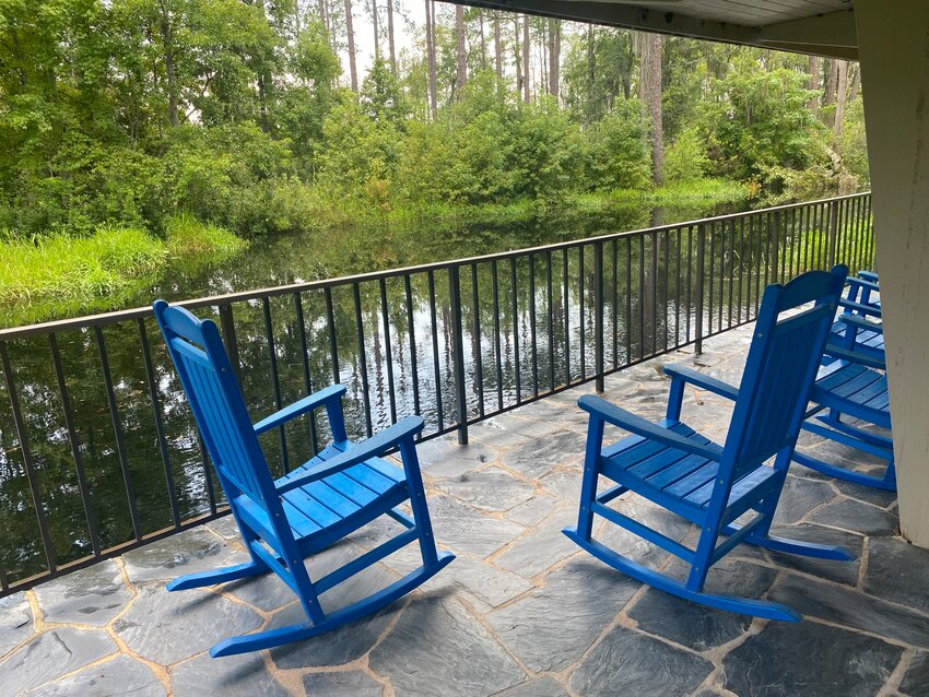 Chairs situated behind the visitor center provide a relaxing place to observe wildlife.