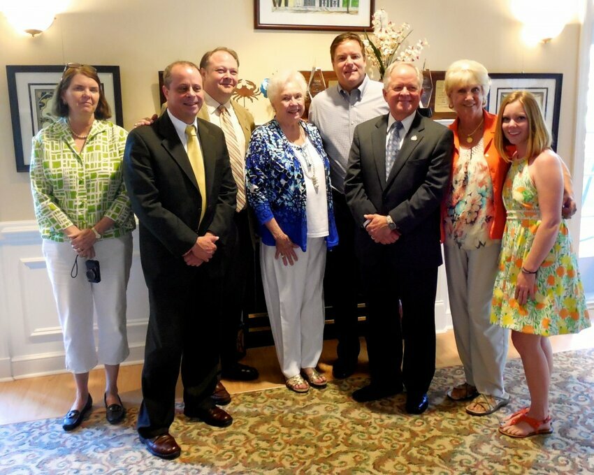 Marilyn Evans Jones surrounded by current and former elected officials.  And a grand daughter. 