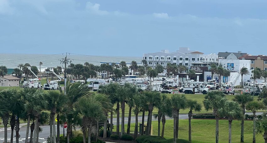 Utility workers, most from North Carolina, wait at Main Beach to be deployed to Tampa after Hurricane Milton passes.