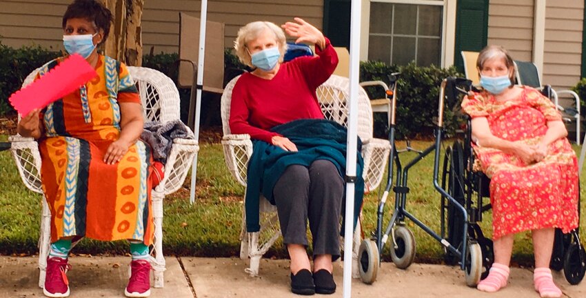 Drive-by visiting at Jane Adams House, July 2020. Caroline Hart, age 93, center.
