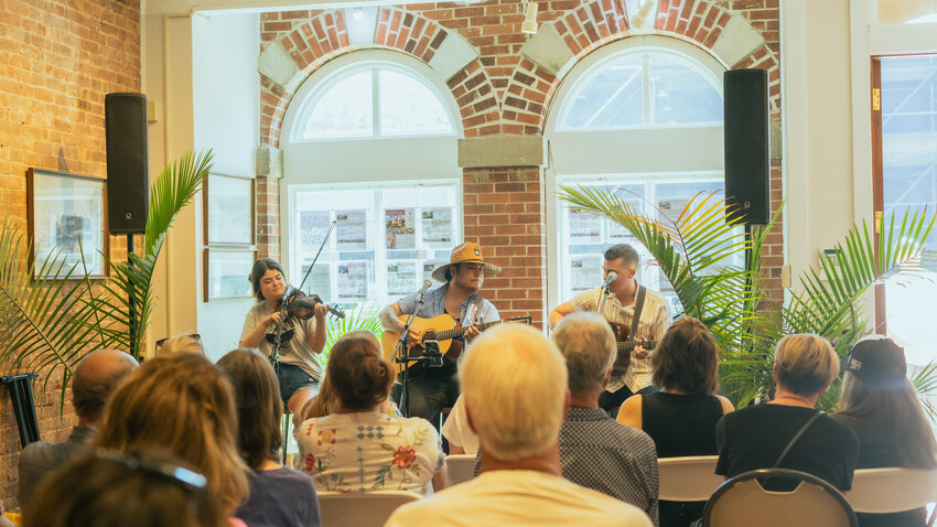 Brenna Wheeler, Daniel Ethridge and Eli Wheeler of Troubadour Blue at Heymann Williams Realty during the festival in 2024.