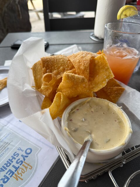 Crab queso dip with wonton chips.