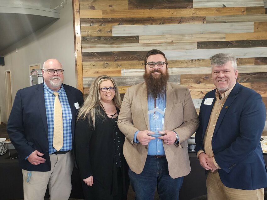 (From left): Publisher John McLoone, Editor Sarah Nigbor, Advertising Director Jack McLoone and Community Outreach Director Jeff Bjork accept the EDC Cornerstone award Thursday, May 2.
