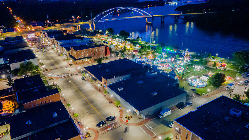 The view from above as the Spin Doctors were finishing their portion of the Rivertown Days concerts in downtown Hastings. The riverfront provides the perfect backdrop for the carnival rides and midway games.