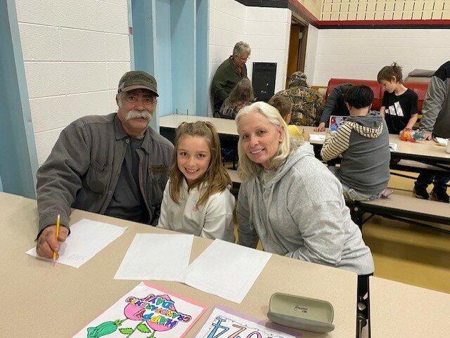Reagan Friedenfels crafting with her grandparents. 