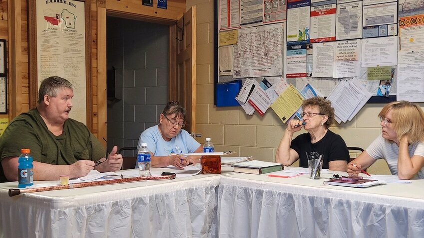 Village President Randy Madlon explains the Local Road Improvement Project bid process to board members at the May 13 meeting at the Lublin Town Hall. From left are Madlon, Village Clerk Rita Niznik, Village Treasurer Pat Siudak, and Trustee Christine Compagnone. 