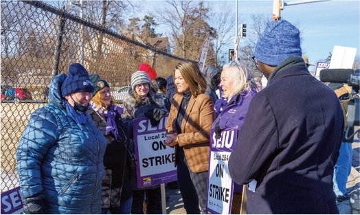 US Representative Angie Craig paid a visit to the striking Food Service Workers along Highway 61 near Todd Field on Friday, February 17. Craig spoke with many of the workers offering her support of their fight for improved wages. Photo by Bruce Karnick