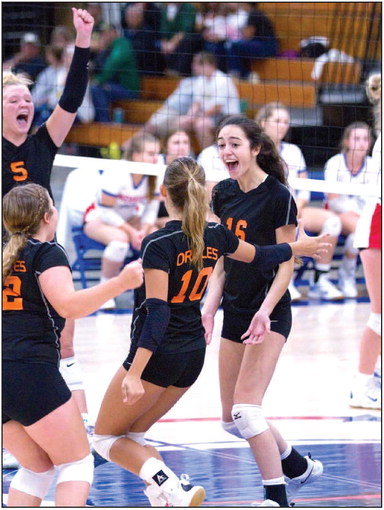Team members exult in a win at Merrill Saturday. The girls volleyball team took second place behind Chi-Hi at the Merrill tournament September 10. Photo by Heather Vait.