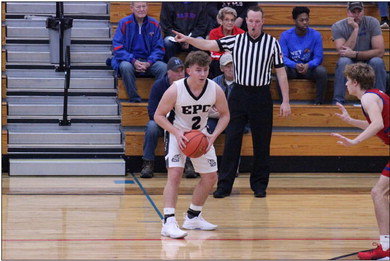 Elmwood/Plum City junior Blake Allen scans the floor during the Wolves&rsquo; game against Alma/ Pepin on Wednesday, Dec. 28. Allen is one of two elite shooters on the EPC roster who has elevated his game in recent weeks. Photo by Reagan Hoverman