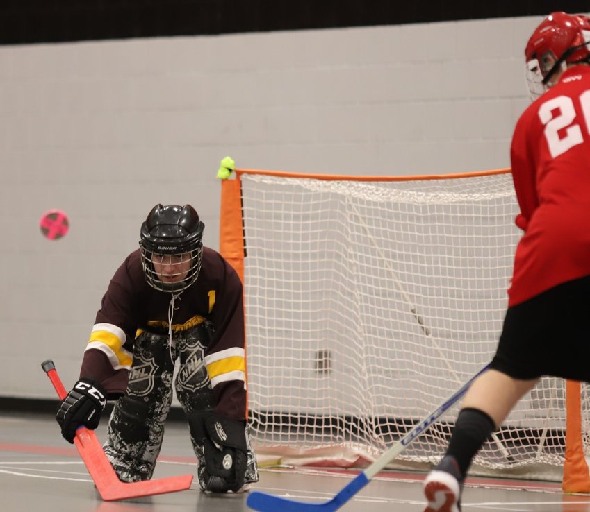 Thunderbolts goalie Logan Yannarelly knocks down a shot attempt in the second half.