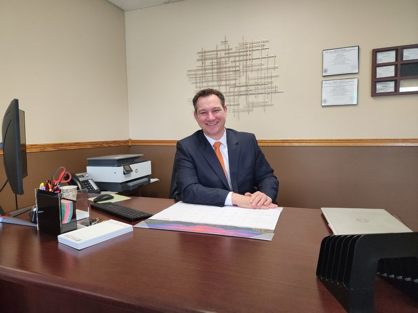 Joe Mahn of Mahn Family Funeral &amp; Cremation Services sits in the business&rsquo;s planning office at 344 W. Main St. in Ellsworth. A new chapel will be built in Crossing Meadows Business Park.