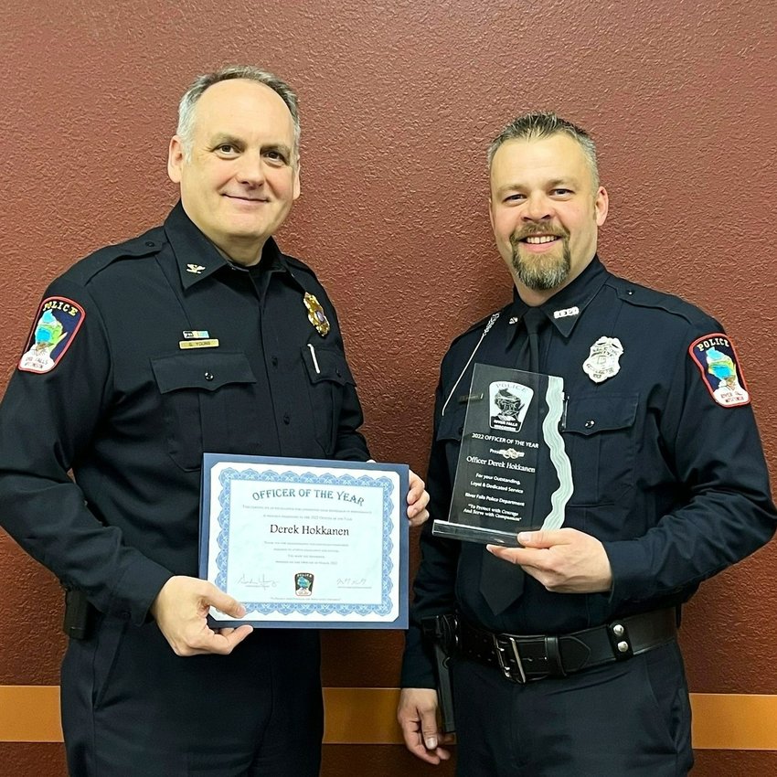 River Falls Police Chief Gordon Young (left) presents Derek Hokkanen with the 2022 Officer of the Year award. Hokkanen was recognized at the March 14 River Falls City Council meeting.