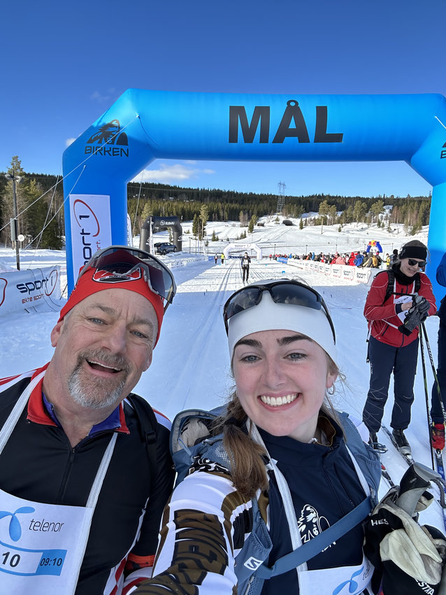 Peter Rayne (left) and his daughter Ellen Rayne (right) take a selfie shortly after finishing the 2023 iteration of the Birkebeinerrennet in Lillehammer, Norway. Peter and Ellen crossed the finish line at the same time after completing the 34-mile Worldloppet race.