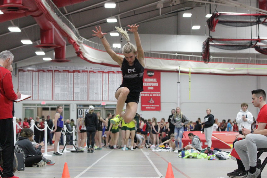 Elmwood/Plum City senior Izzy Forster takes flight during the long jump event at the UWRF High School Invitational on Thursday, March 30. Forster jumped her way to a sixth-place finish at the indoor meet.