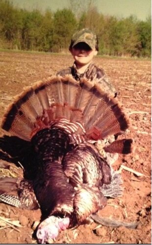 My nephew Reid with his turkey, a reminder to send in your photos as well.