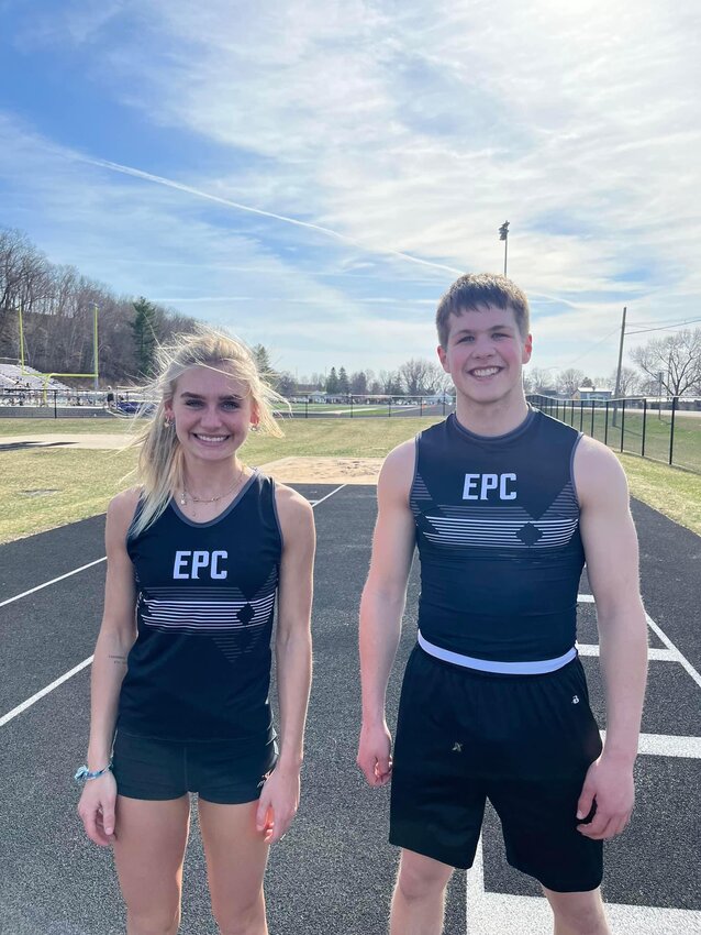 Elmwood/Plum City seniors Izzy Forster and Trevor Asher celebrate together after breaking a combined three school records at the Durand Invite on Tuesday, April 11. Asher broke the boys&rsquo; long and triple jump records while Forster claimed the girls&rsquo; triple jump record.