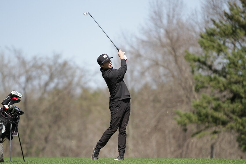 Ellsworth senior Ethan Oricchio hits his second shot from the middle of the fairway of the eighth hole at the Ellsworth Country Club on Tuesday, April 18. Oricchio shot a three-over par 39, which secured a fourth-place finish.