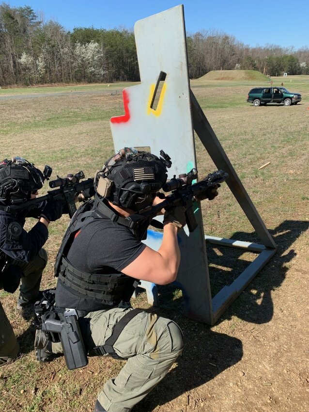Bryce Lindevig at the shooting range for motorcade training on a live range with Emergency Response Team and Counter Assault Team members.