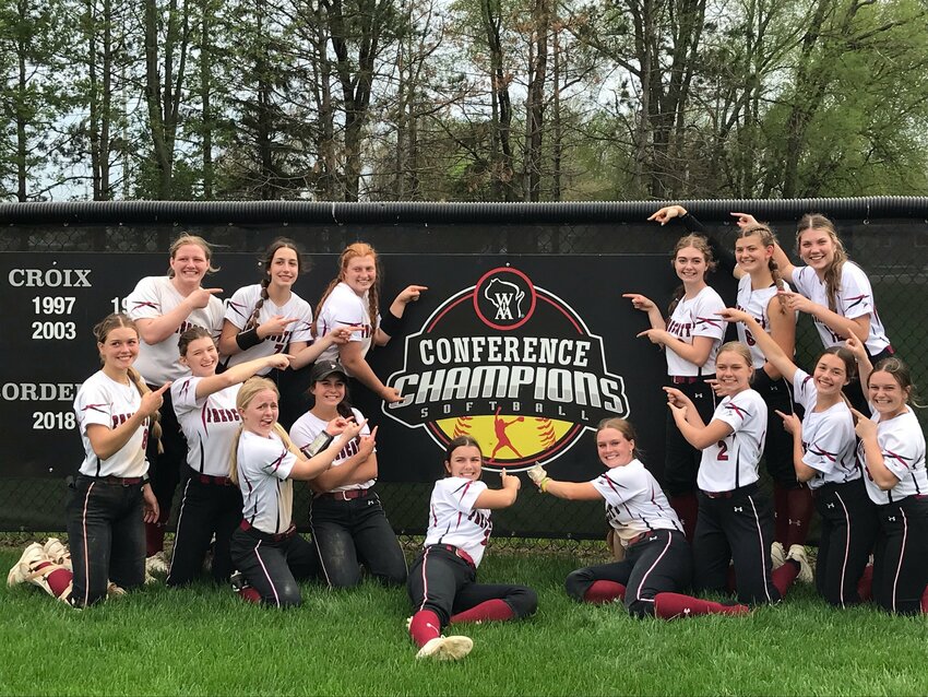 The Prescott High School softball team celebrates with the conference championship banner in the outfield at Biggs Frey Memorial Field in Prescott after winning the 2023 Middle Border Conference title on Friday, May 12.