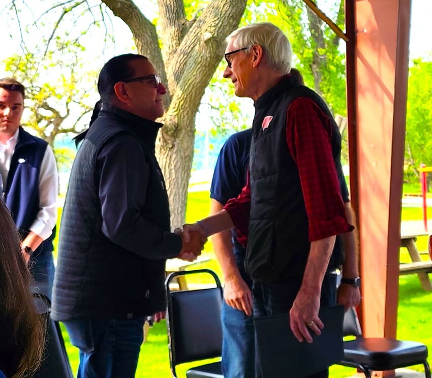 Johnny Johnson, council president of the Prairie Island Indian Community (left) and Gov. Tony Evers greet one another at the Upper Pool 4 Islands Complex Project groundbreaking ceremony May 16 in Bay City.