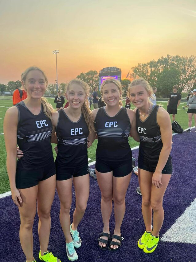 Elmwood/Plum City seniors (from left) Hannah Forster, Allyson Fleishauer, Lily Webb and Izzy Forster celebrate together after winning the conference championship in the girls&rsquo; 4x200-meter relay in Durand on Tuesday, May 16.