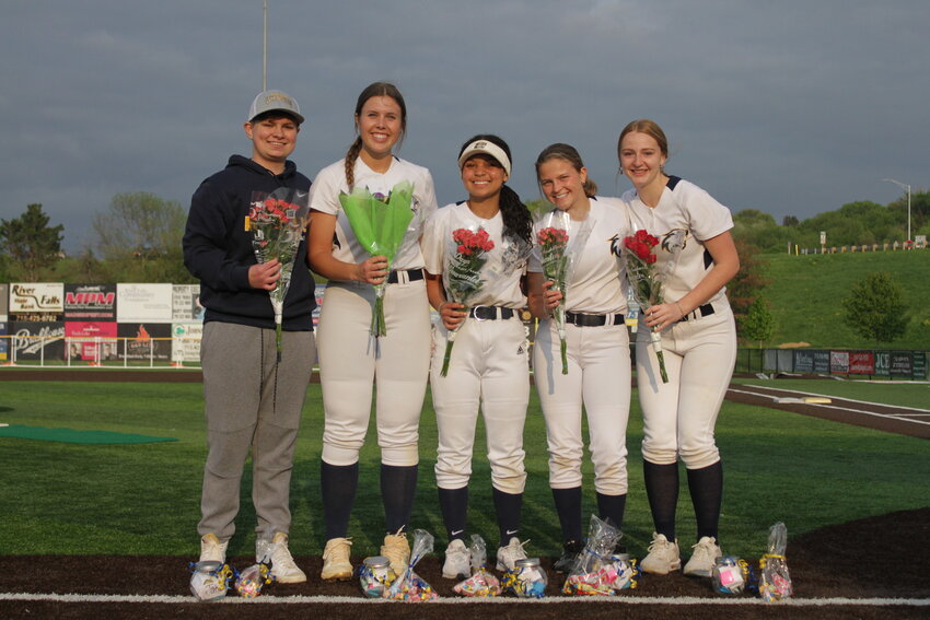 (From left): River Falls senior softball manager Jake Pederson joins senior players Avery Amidon, Star Deiss, Ali Laube and Alisha Latham as they celebrate senior night at First National Bank of River Falls Field on Friday, May 19.
