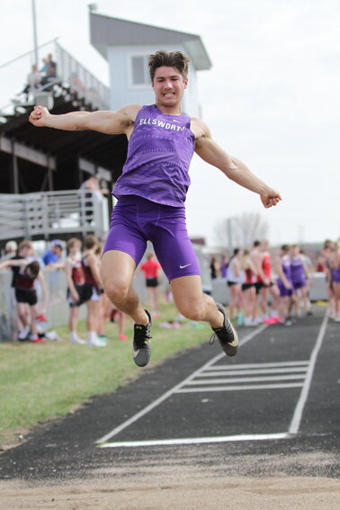 Ellsworth senior Bo Hines takes flight during a long jump earlier this season. Hines won his third consecutive individual Middle Border Conference championship in the long jump in Altoona on Tuesday, May 16.