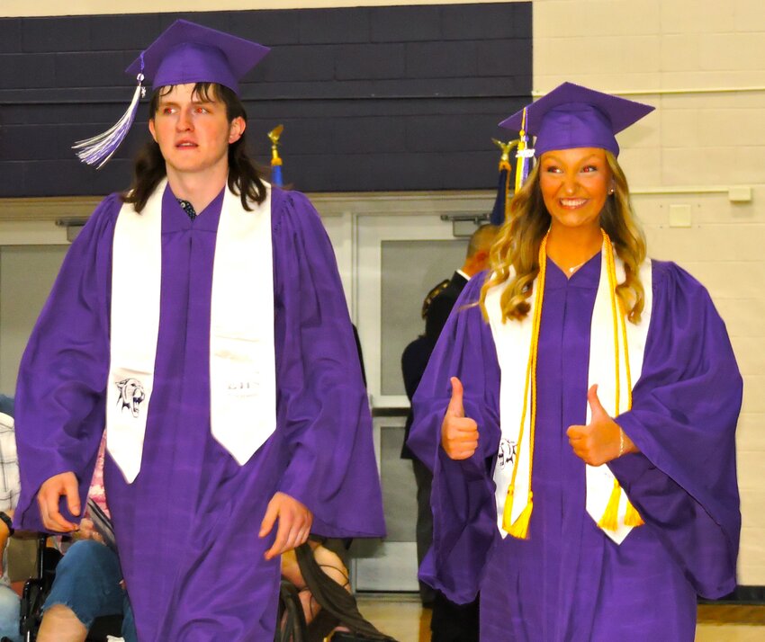 Seniors Seth Rohl and Payton Rohl march in the EHS graduation processional Friday, May 26