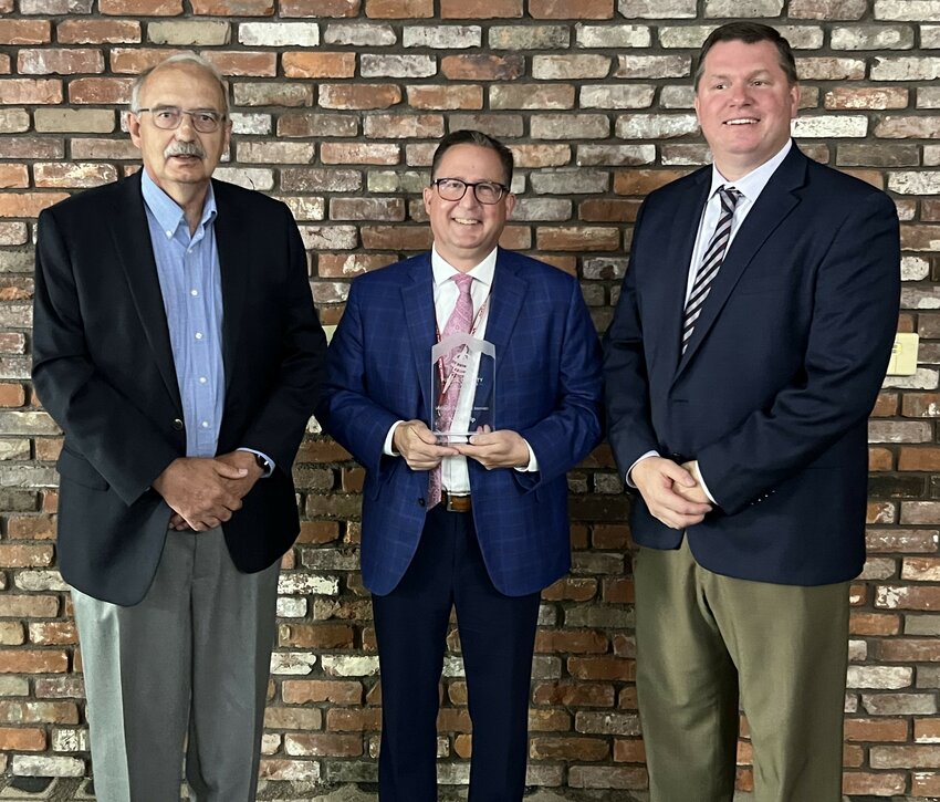 John McHugh, director of corporate communications for Kwik Trip, accepted the Workforce Development Innovation Award from the Pierce County Economic Development Corp. Pictured with McHugh (center) are PCEDC Executive Director Joe Folsom and President Nate Boettcher.