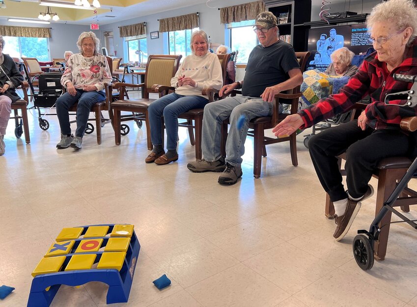 Every Monday afternoon, residents at Plum City Care Center compete in a game of Tic Tac Toss.