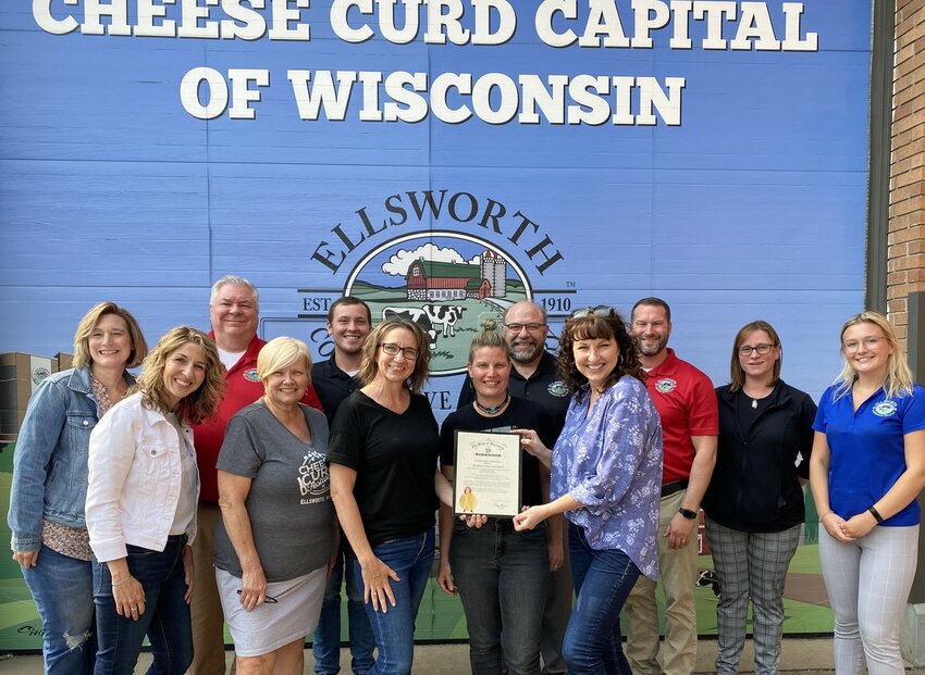 Members of the Ellsworth Area Chamber of Commerce and Ellsworth Cooperative Creamery display a Certificate of Achievement signed by Gov. Tony Evers for being named to the USA Today 10 Best Readers&rsquo; Choice Travel Award Contest for 2023.