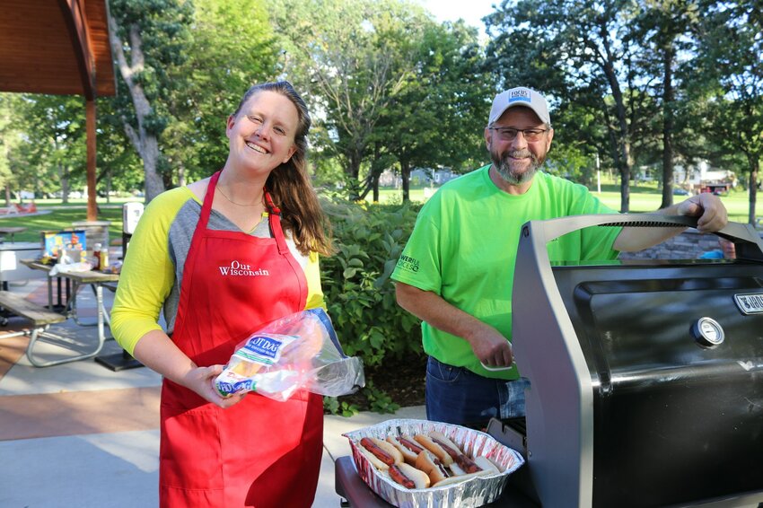 River Falls Mayor Dan Toland (right) grills up hotdogs during a previous Mayor&rsquo;s Cookout Conversation.