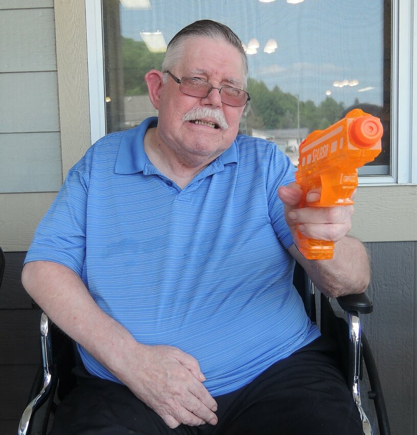 Ivan Mason is ready to pull the trigger during a Plum City Care Center water gun fight.
