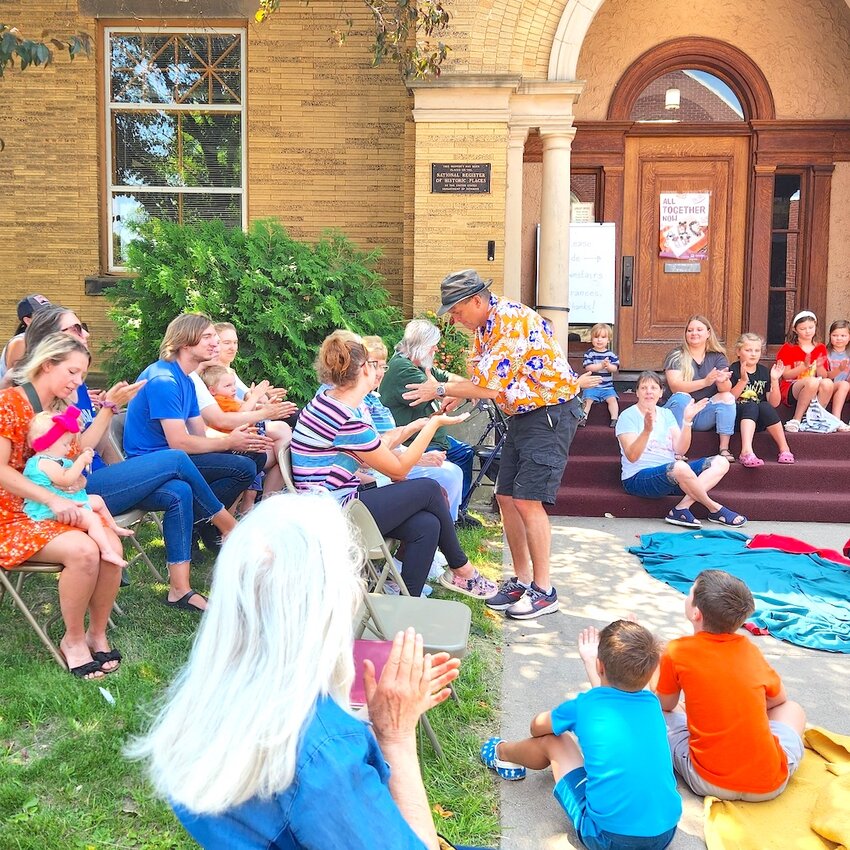 The Spoon Man interacts with local community members during the musical comedic experience as he reminds the attendees to read for 20 minutes every day and the library is a weight room for your brain.