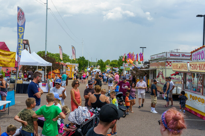 The food truck area located in the Levee Park parking lot is always hopping during Rivertown Days. It is close to the carnival and the street stages making it accessible for everyone.