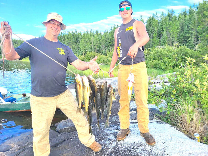 Scott and Preston Polencheck after a rewarding day of fishing near Valora, Ontario.